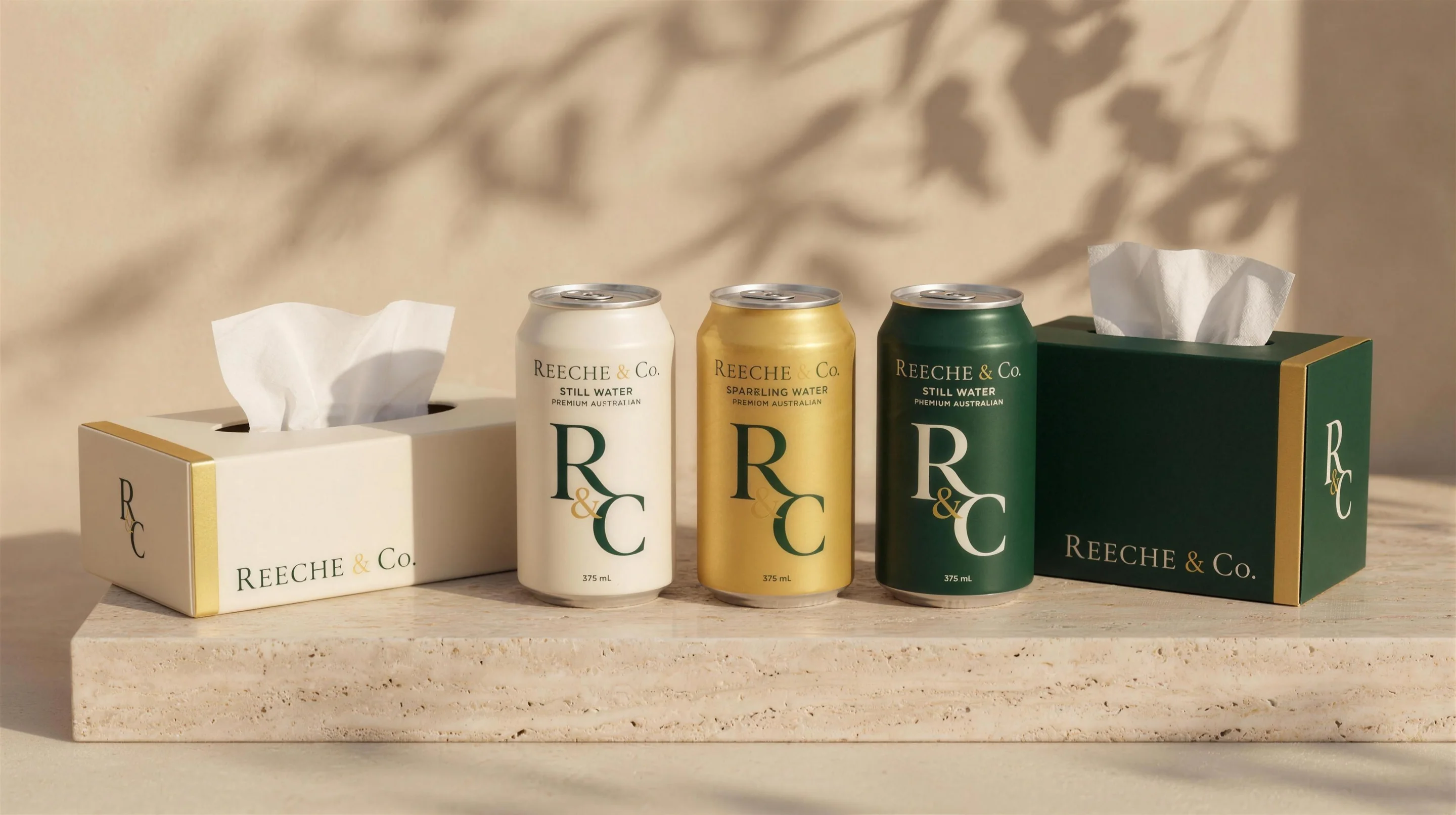 REECHE & CO. cans and tissue box in a warm hotel lounge at golden hour
